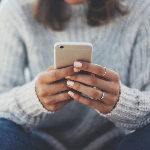 Woman texting on her phone